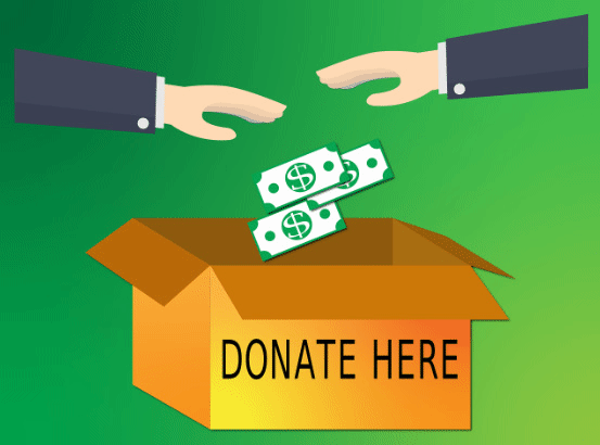 Cash being donated into a box